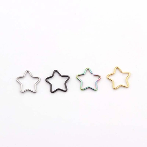 Star-shaped 316L stainless steel piercing rings in silver, black, gold, and rainbow finishes