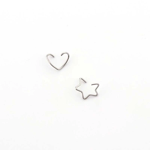 Detail of silver 316L stainless steel heart and star shaped ear piercing hoops