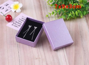 Purple textured jewelry gift box measuring 7x9x3cm with butterfly tassel earrings inside