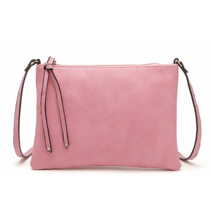 Detailed view of pink PU leather crossbody bag with golden zipper and adjustable strap