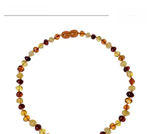 Detailed top view of natural Baltic amber beaded necklace with multicolor stones