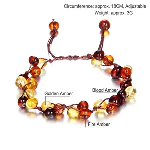Handmade amber beaded bracelet with adjustable cord featuring mixed golden and blood amber