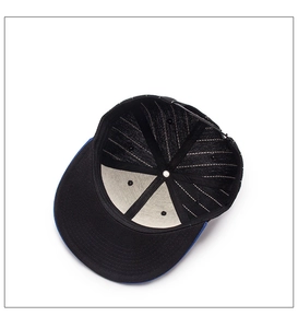 Detailed interior of a two-tone baseball cap showing stitching and inner sweatband