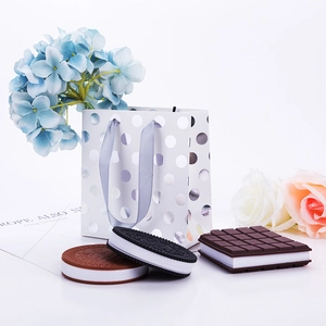 Silver polka dot paper gift bag set with Oreo and chocolate bar style notebooks