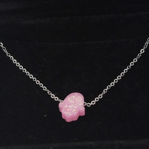 Pink glitter Hamsa Hand synthetic opal pendant necklace with silver chain on velvet