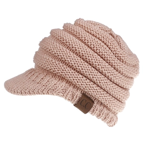 Detail of pink knitted baseball cap with fuzzy texture and C.C brand leather patch