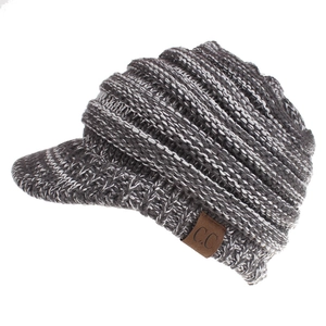 Detailed close-up of grey mélange knit texture and brown C.C leather patch on visor beanie