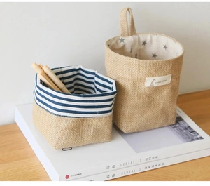 Detail of hanging jute organizer with giraffe label and star lining for home storage
