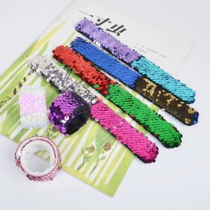 Colorful sequin slap bracelets for kids available in purple, blue, red, and green colors
