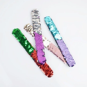 Close-up of colorful sequin slap bracelets for kids featuring reversible flip sequins
