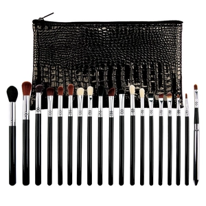 Detail of 18-piece black eyeshadow brush set with a textured crocodile pattern makeup bag