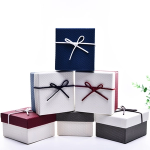 Elegant square jewelry gift boxes with ribbon bows in assorted colors and textured finish