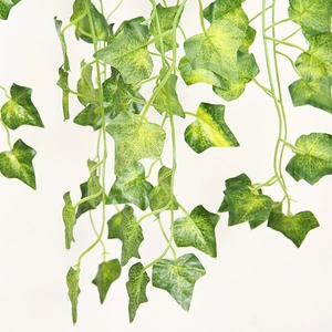 Close-up of artificial green ivy vines with realistic leaf texture and hanging details