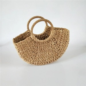 Handmade crescent straw tote bag with round top handles for summer beach and daily use