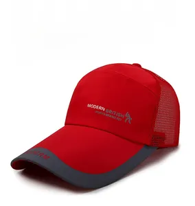 Detail showing red and grey mesh fabric texture and Modern British embroidery on the cap