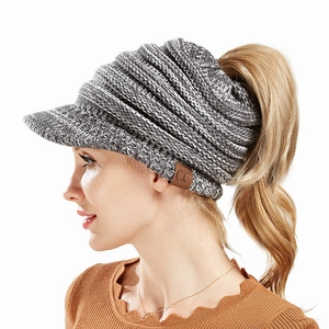 Grey knit ponytail beanie with sun visor and C.C leather patch for women's winter wear
