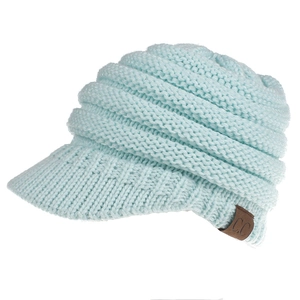Close-up of light blue knit ponytail beanie featuring thick texture and C.C leather patch