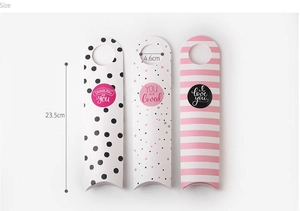 Detail of three patterned long pillow boxes with sizes 23.5x4.6cm for cookie packaging