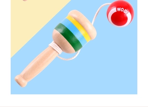 Detailed close-up of striped wooden Kendama handle and red ball with WODI lettering