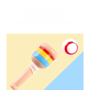 Close-up of wooden kendama toy showing striped handle and branded red-white ball details