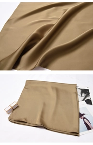 Close-up of elegant champagne silk scarf texture with professional draped finish and sheen
