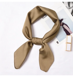 Detailed view of champagne satin neck scarf with a silky texture and elegant bow knot