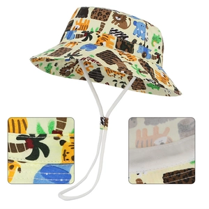 Detail of stitches and fabric on cream bucket hat with cartoon animal print