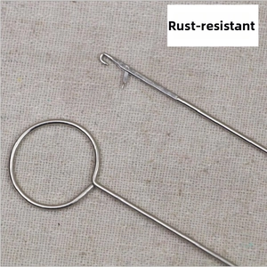 Close-up of stainless steel crochet needles with smooth metal texture and latch hook detail