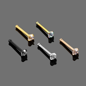 Detail of five stainless steel nose studs with round cubic zirconia in various plating colors