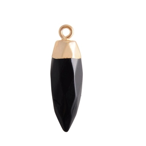 Macro view of a faceted black agate bullet pendant with a gold-plated metal cap
