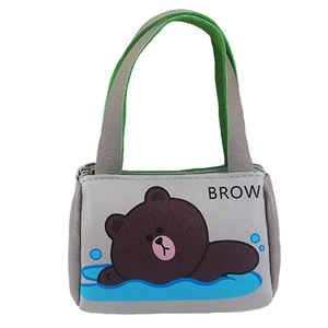 Miniature gray doll handbag with green handles featuring a brown cartoon bear print