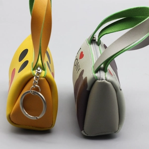 Miniature PU leather pouches featuring cartoon faces with zippers and keychains