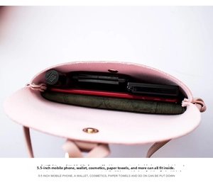 Interior view showing phone and wallet storage in a pink mini crossbody bag
