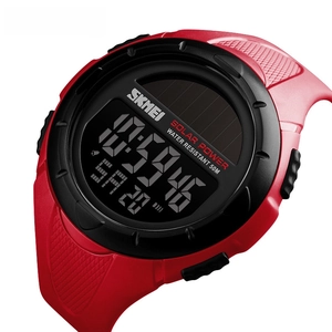 Detailed close-up of SKMEI solar-powered sports watch with red strap and digital display