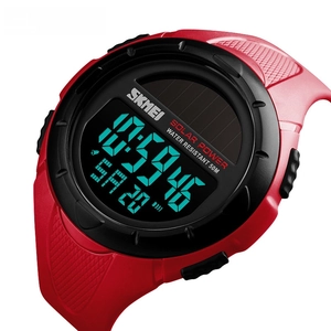Detailed close-up of solar-powered digital sports watch with red strap and 50m water resistance