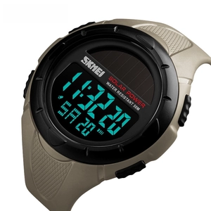 Detailed view of digital sport watch with solar power panel and khaki rugged strap
