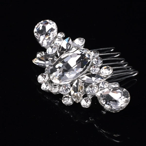 Detailed view of silver wedding hair comb with sparkling crystals and rhinestones