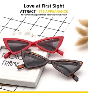 Close-up of retro cat-eye sunglasses featuring red and tortoise frames with model number