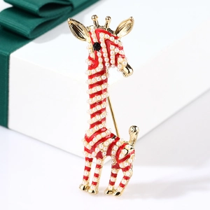 Detail of giraffe enamel brooch with white pearls and red oil dripping on gold alloy