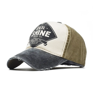 Close-up of vintage washed cotton baseball cap with distressed brim and tricolor design