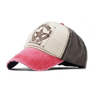 Detailed side view of vintage washed cotton baseball cap with distressed brim and badge print