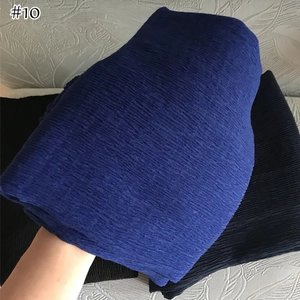 Detail showing the pleated texture of royal blue and black cotton linen scarves