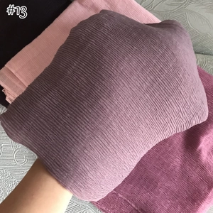 Macro detail of lavender pleated cotton linen scarf with fine vertical crinkle texture