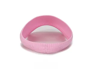 Detail view of pink ribbed knit sun visor headband showing back seamless construction
