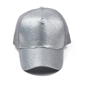 Detailed close-up of shiny silver glitter texture on a grey mesh ponytail baseball cap