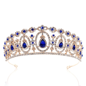 Detailed view of bridal crown with golden plating and blue crystal rhinestones