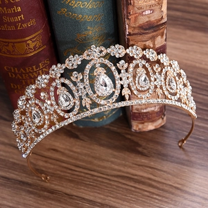 Detail of a bridal gold crown with crystal rhinestones on a vintage book surface
