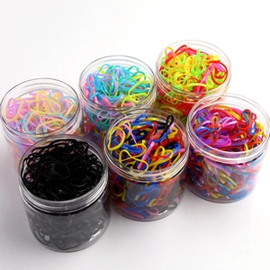 Bulk pack of colorful elastic hair bands for girls in six clear plastic jars