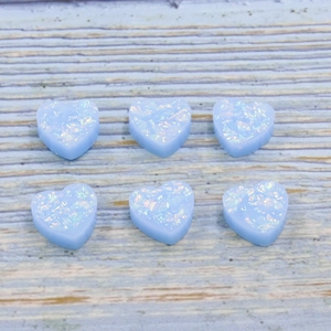 Set of six light blue heart-shaped synthetic opal resin charms with fire flash effect