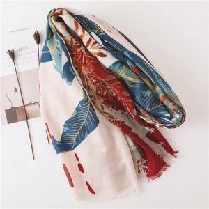 Linen cotton shawl scarf featuring vibrant tropical floral prints and fringed edges